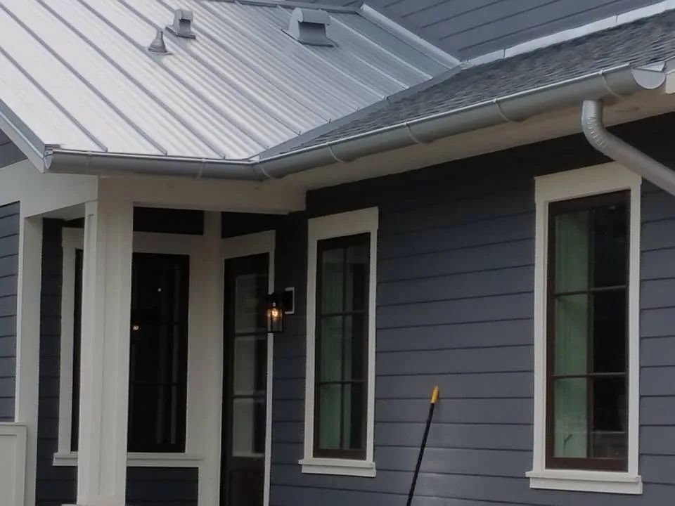 Navy lap siding standing seam porch roof half round gutter, Sanford